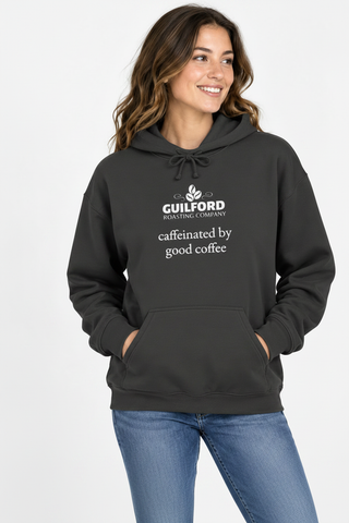 Female model wearing the Dark Heather Caffeinated by Good Coffee Hoodie